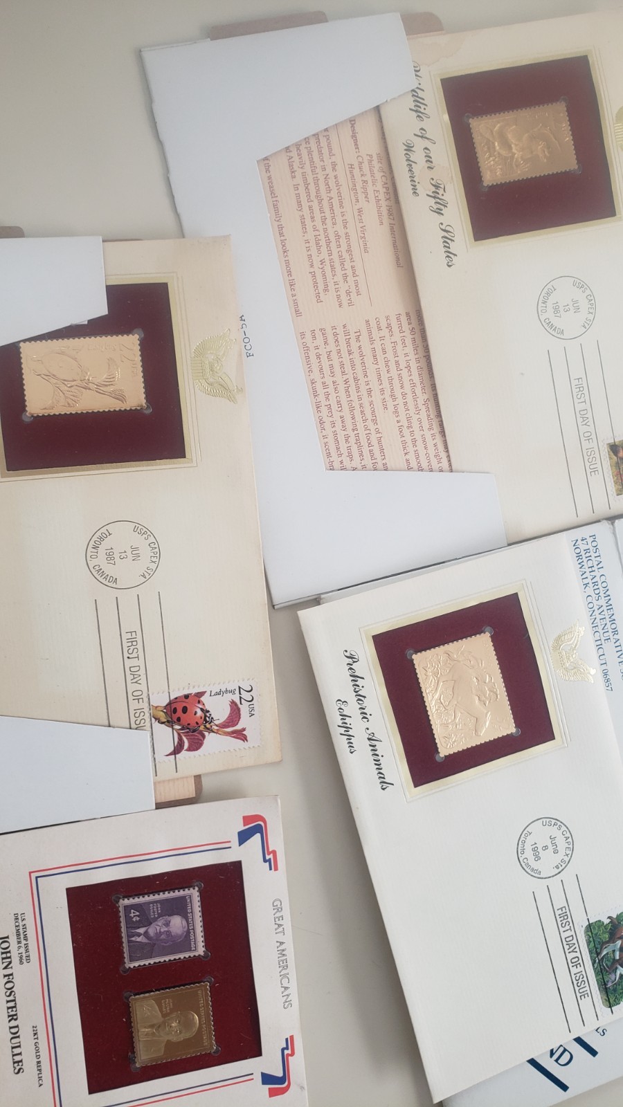 misclineous stamps from different regions of the world and 22kt gold replicas