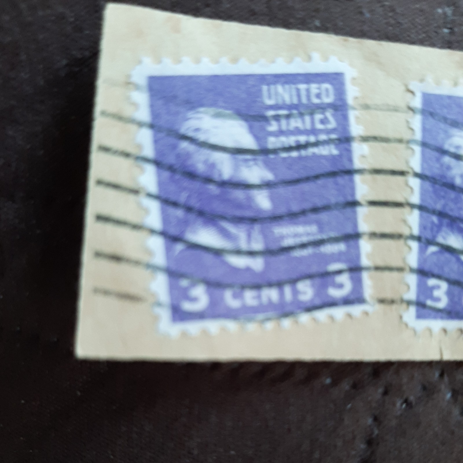 Two 3 cent Thomas Jefferson stamps purple