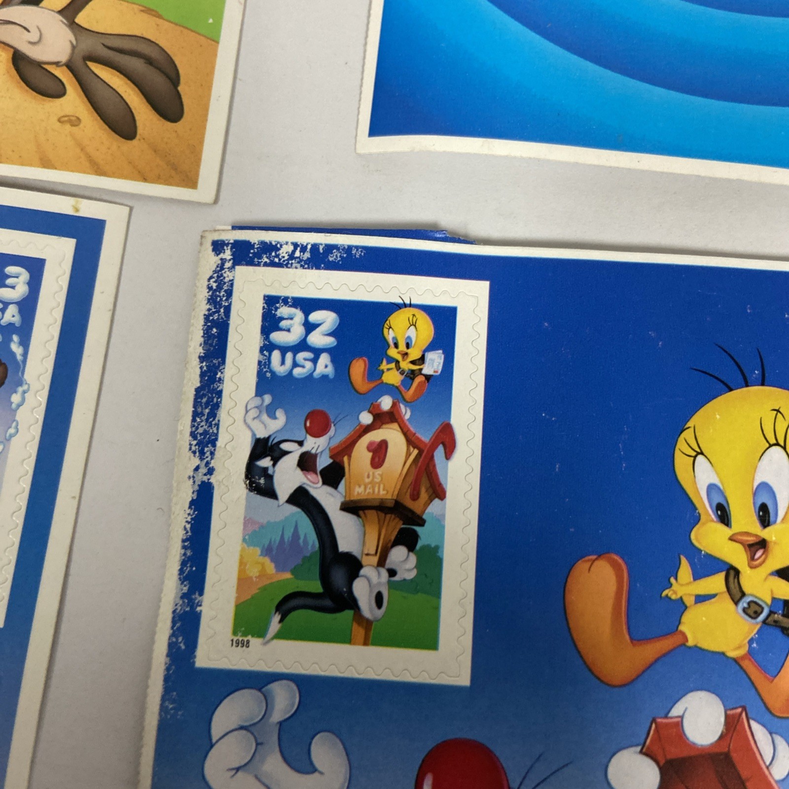 Postage lot of 4 Different Looney Tunes stamps. 7 total stamps