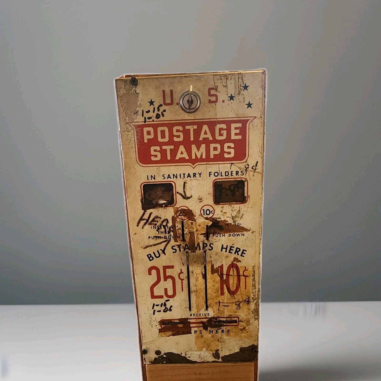 Vintage us postage stamps machine in vintage wood box