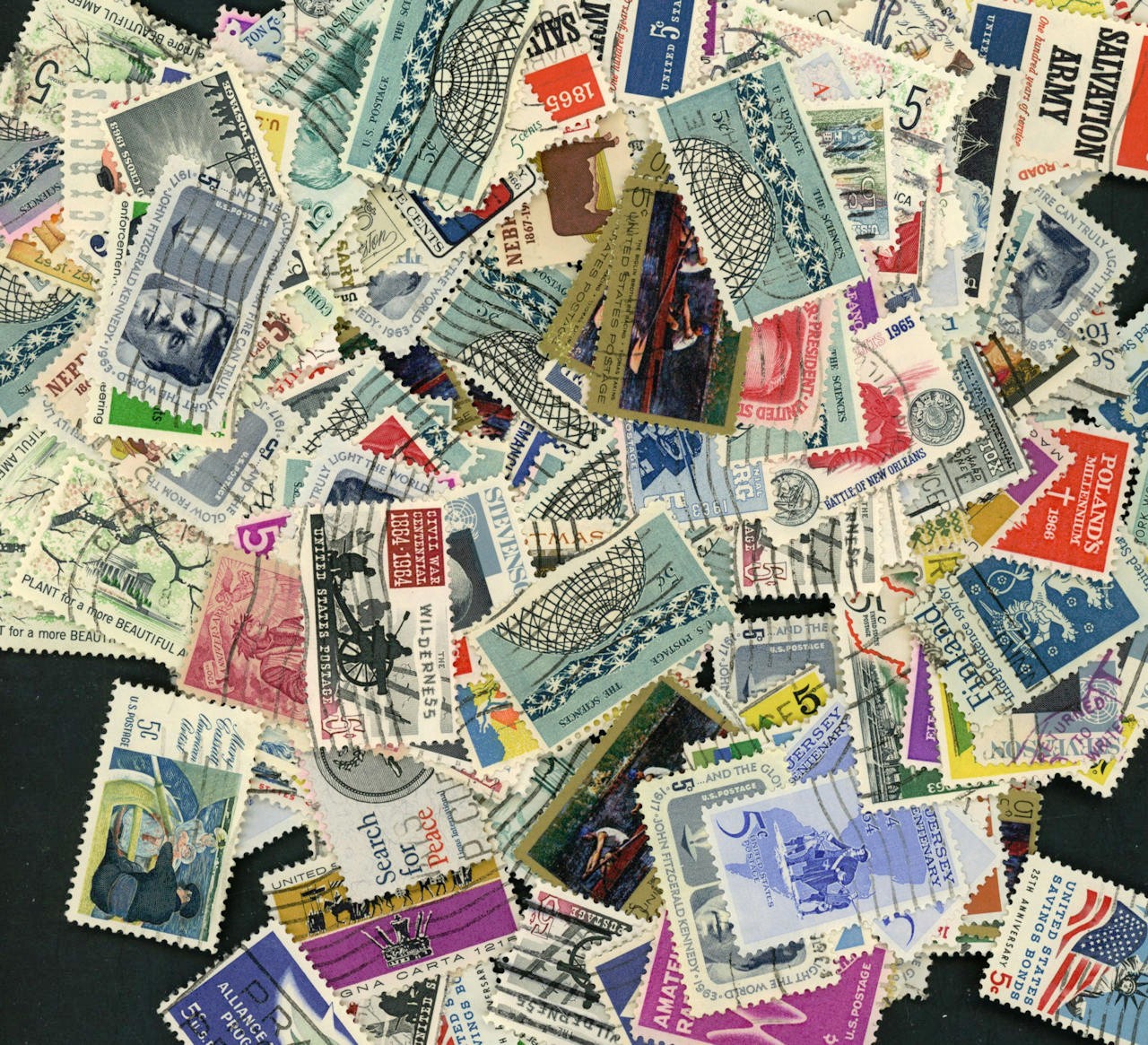 100 U S stamps off paper used Not exactly what is shown