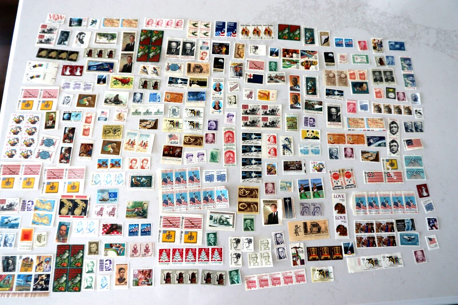 US Postage stamps various denominations mint no gum 1960’s thru 2010.
