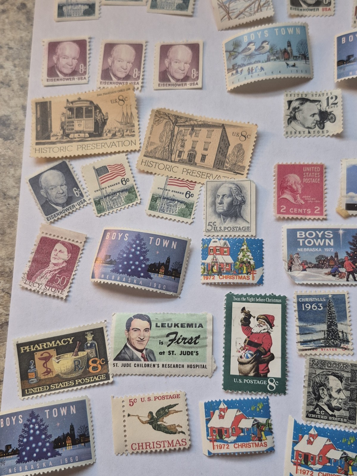 50 Mint condition US postage stamps. Various denominations 1940s,1950s,1960s