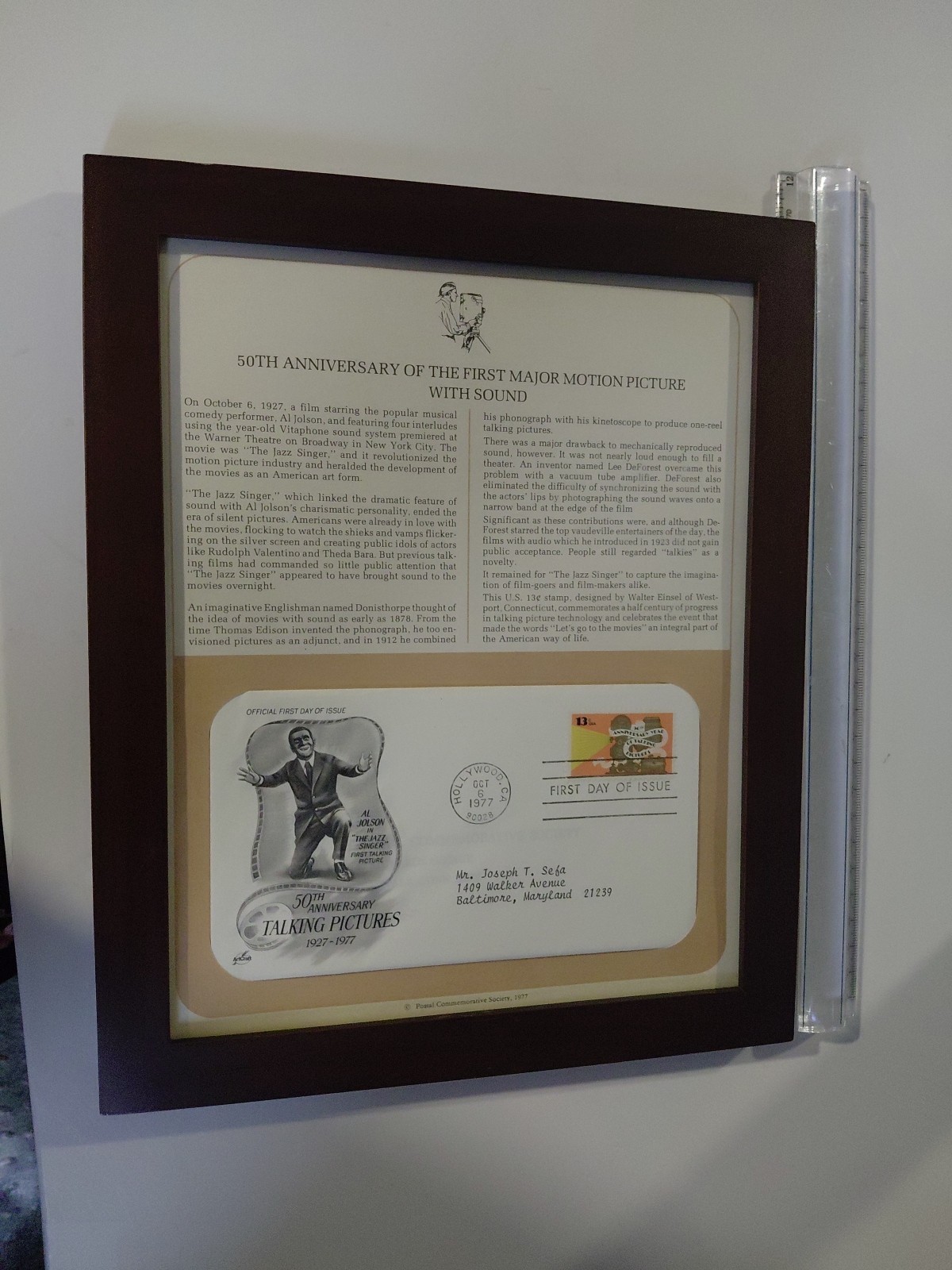 50th anniversary of the first major motion picture with sound stamp. Framed