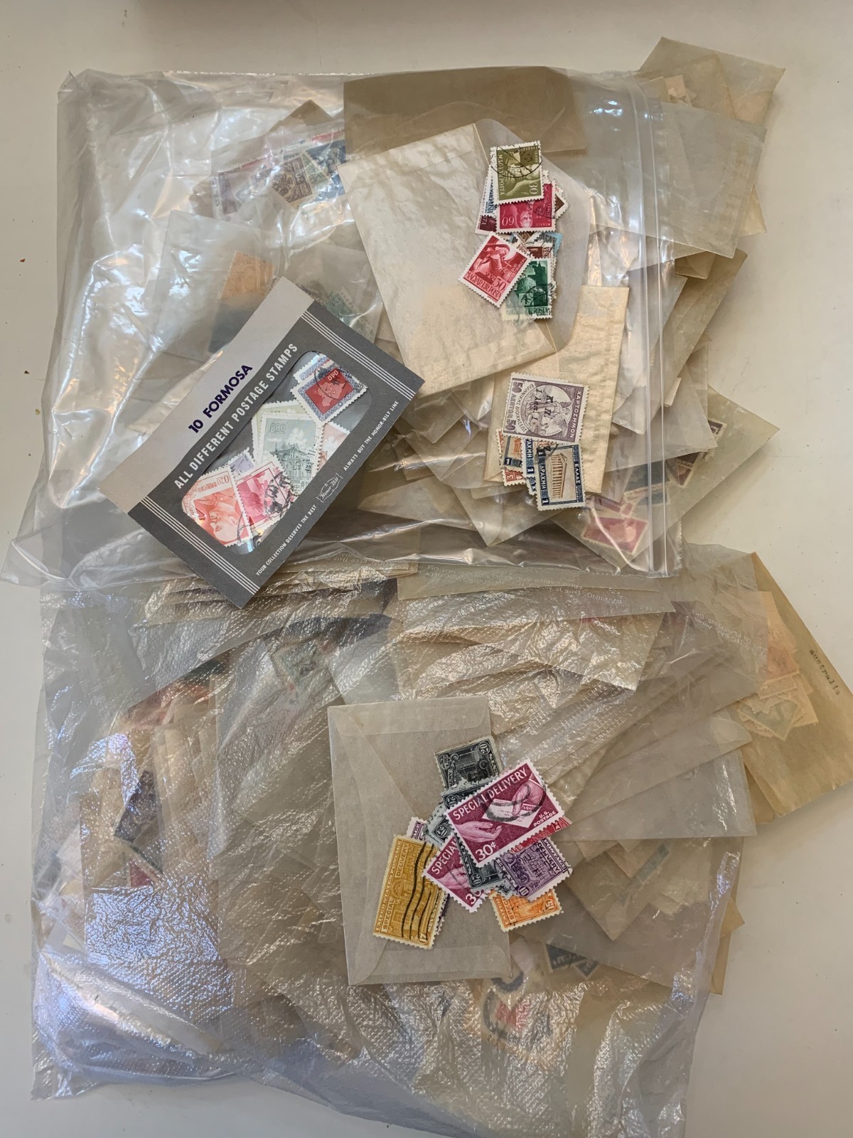 Large lot of vintage used and unused postage stamps, U.S. and other countries