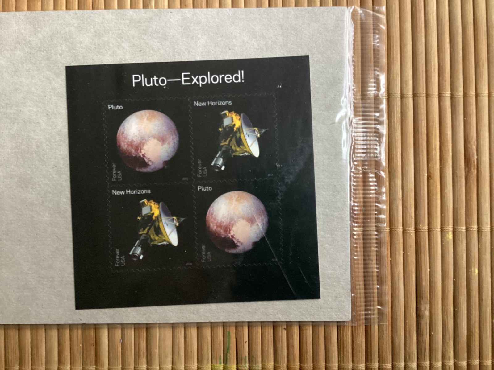 PLUTO EXPLORED 4 count USA Forever stamps-NEVER USED
